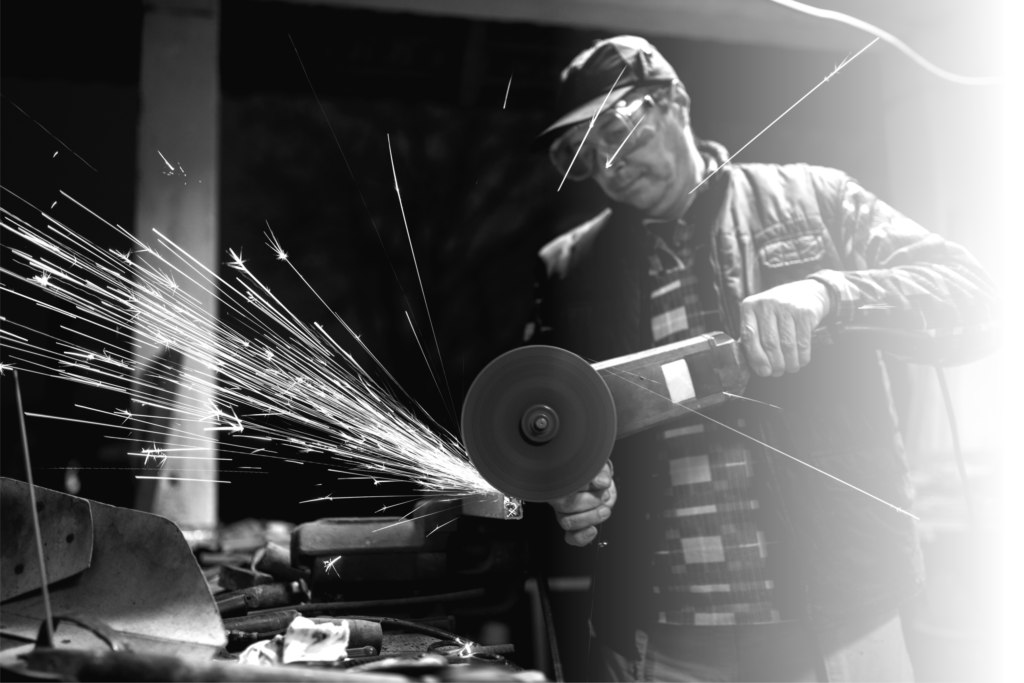 man working on metal cutter/grinder